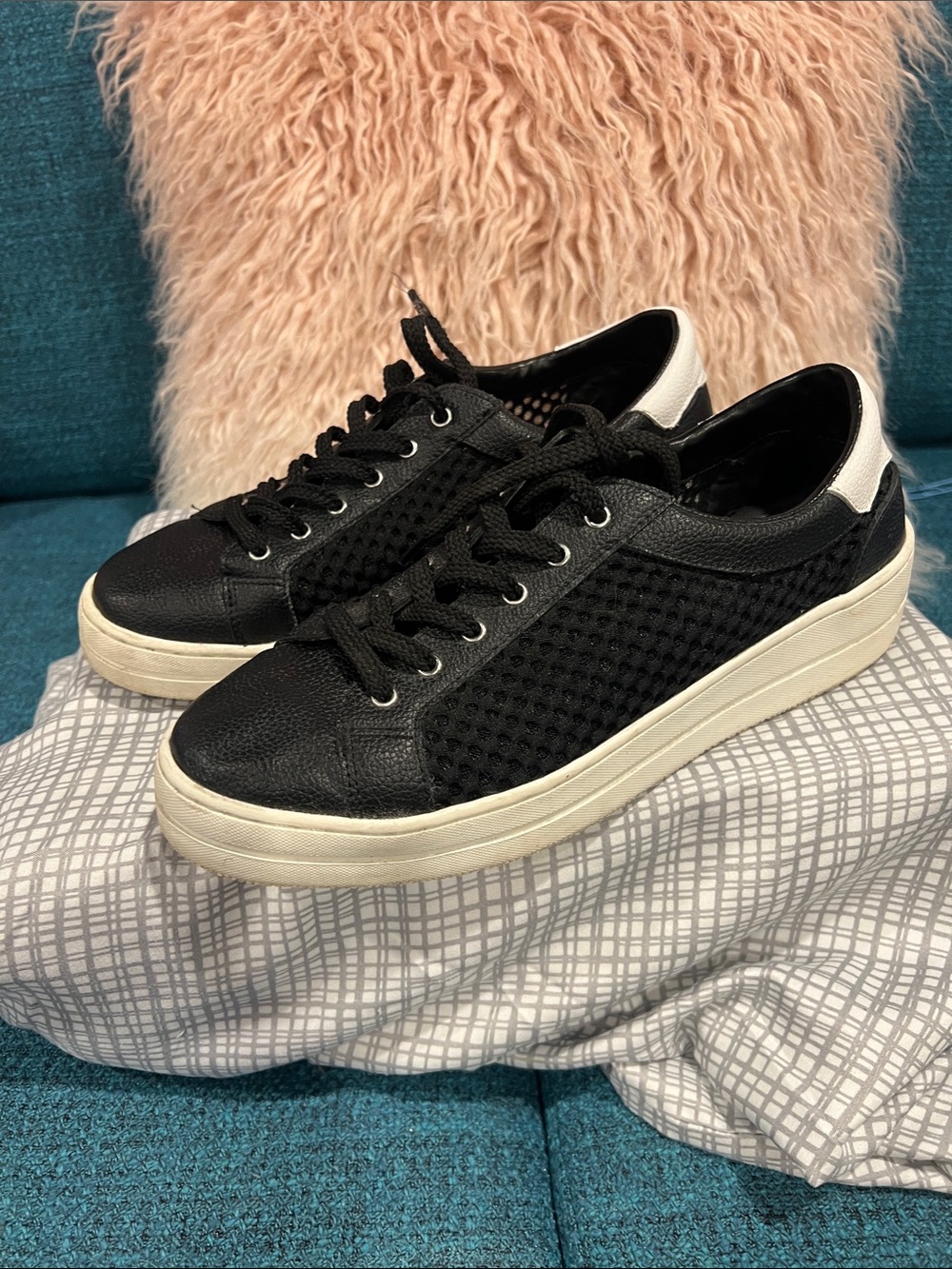 Black leather and cloth netting women’s casual tennis shoe